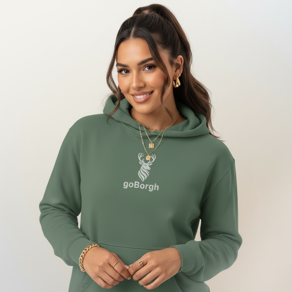 Female model wearing sage green goBorgh® Highland Frontier™ stag hoodie showing relaxed everyday fit
Pigment alpine green