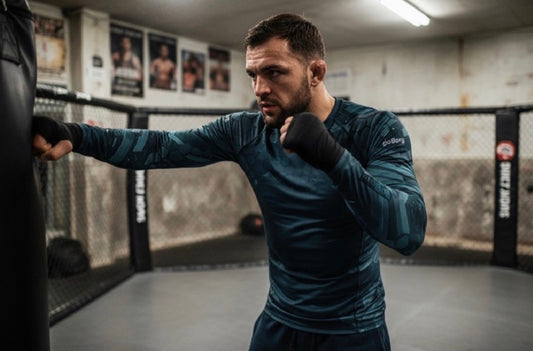 Athlete training in a gym wearing goBorgh Core Sports Performance Training Rash Guard Hex Armor designed for boxing, grappling, and high output workouts
