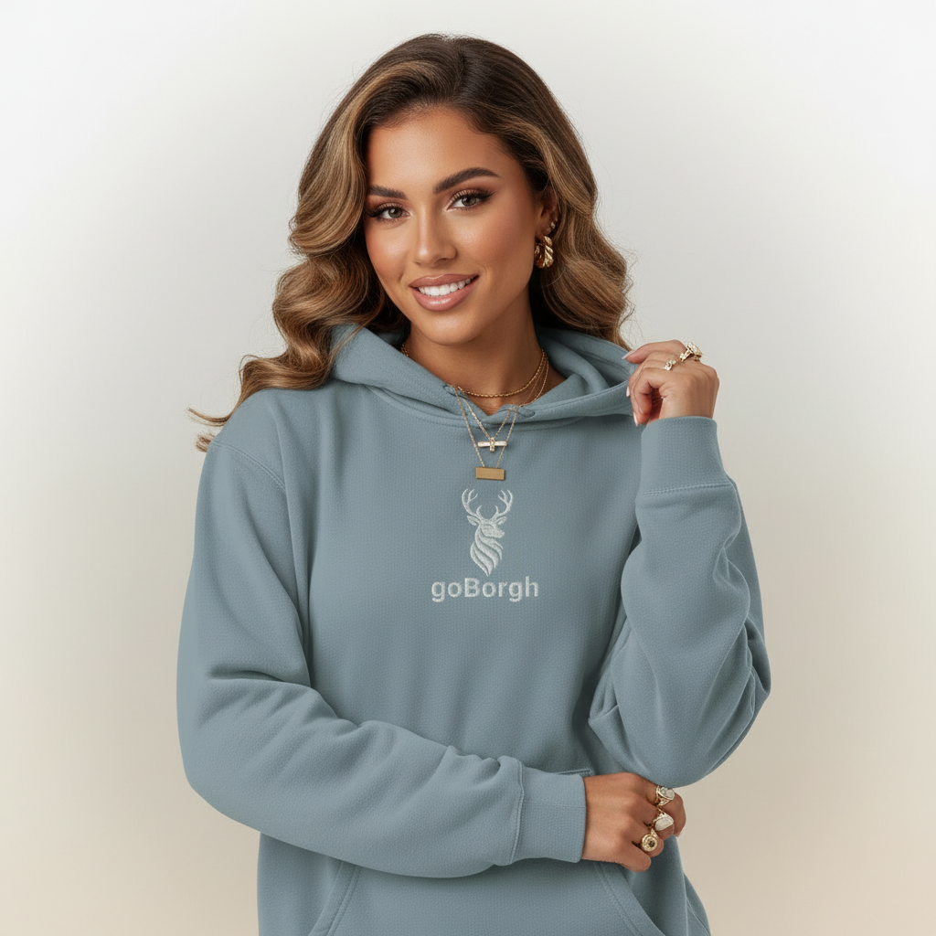 Woman wearing dusty blue goBorgh® Highland Frontier™ stag hoodie showing relaxed premium fit