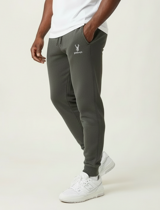 Model wearing Pigment Black Highland Frontier™ Summit Stag goBorgh® premium joggers showing relaxed fit and tapered leg design
