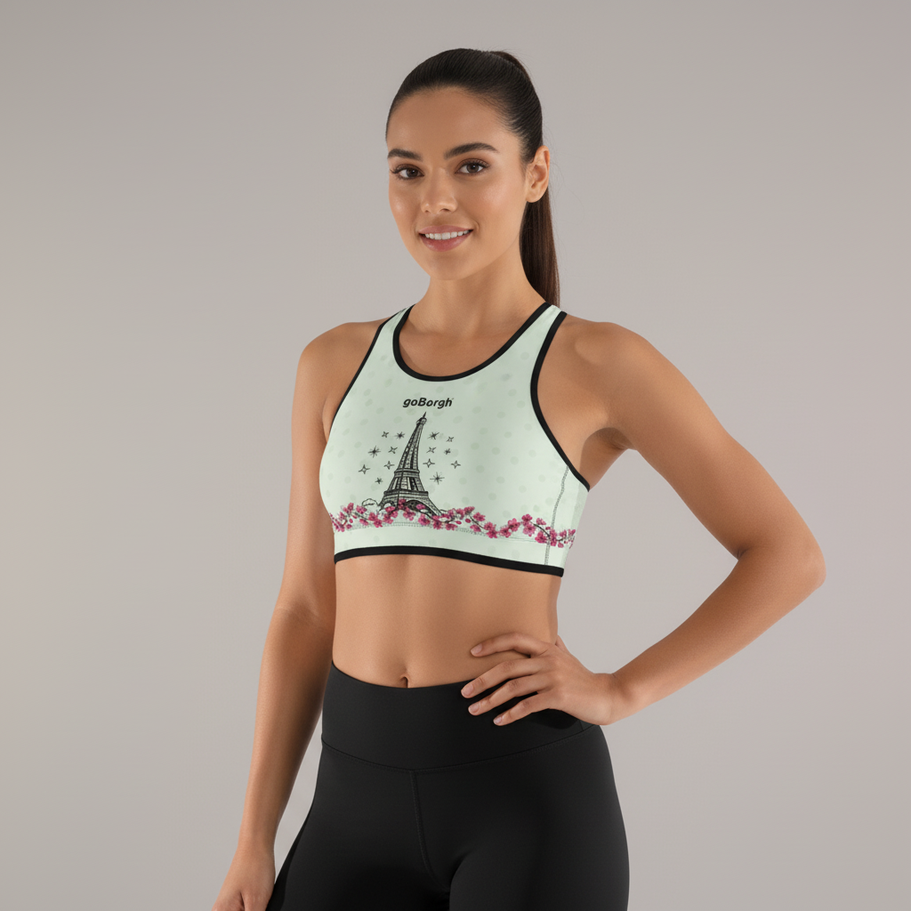 Studio front view of the goBorgh® Paris in Bloom Eiffel Tower Cherry Blossom sports bra highlighting light olive green fabric and cherry blossom design.