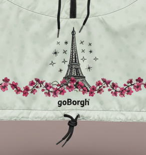 Close-up detail of Paris in Bloom Eiffel Tower illustration and cherry blossom design on goBorgh Paris half zip windbreaker.