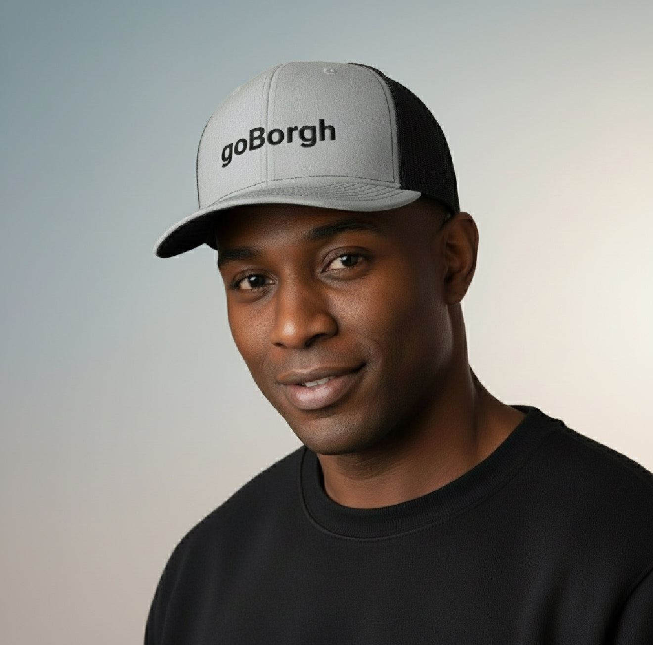 man wearing black and white goBorgh snapback trucker cap in lifestyle portrait