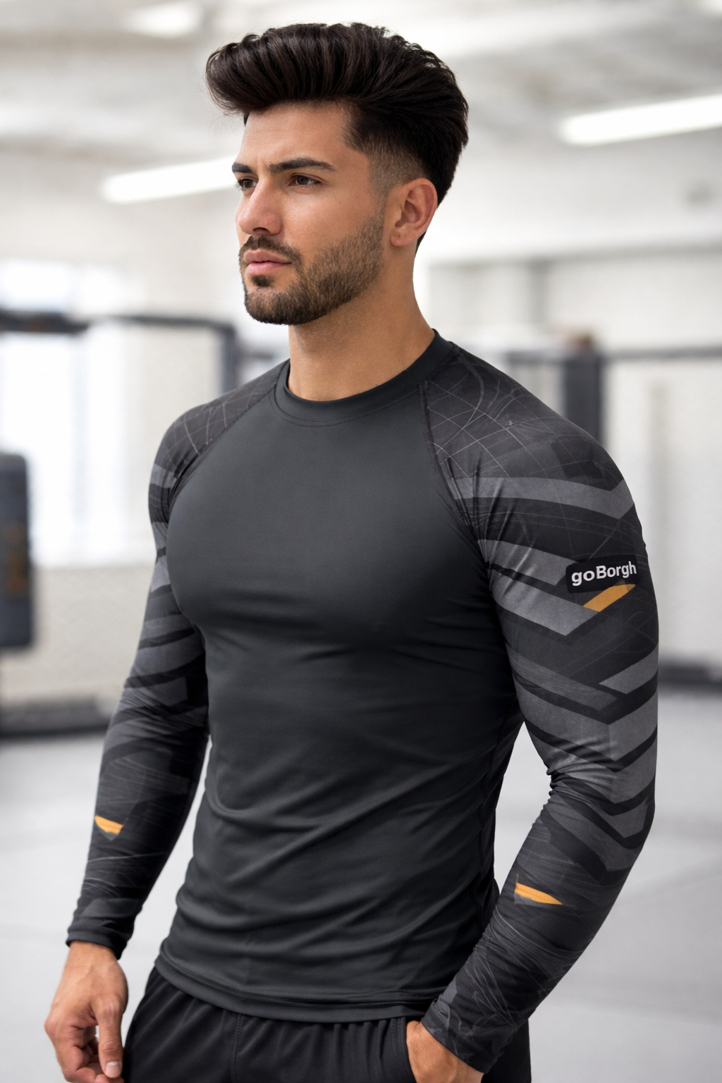 Men wearing the goBorgh Core Sports Performance Training Rash Guard – Steel Plated in a gym setting, showcasing a black compression fit with steel-inspired plated sleeve graphics engineered for MMA training, strength workouts, and high-intensity performance.